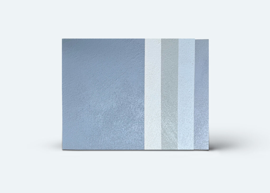 Musterplatten in verschiedenen Blau- und Grautönen für fugenlose Wandgestaltung mit COLORIAMO-Marmor-Streichputz.