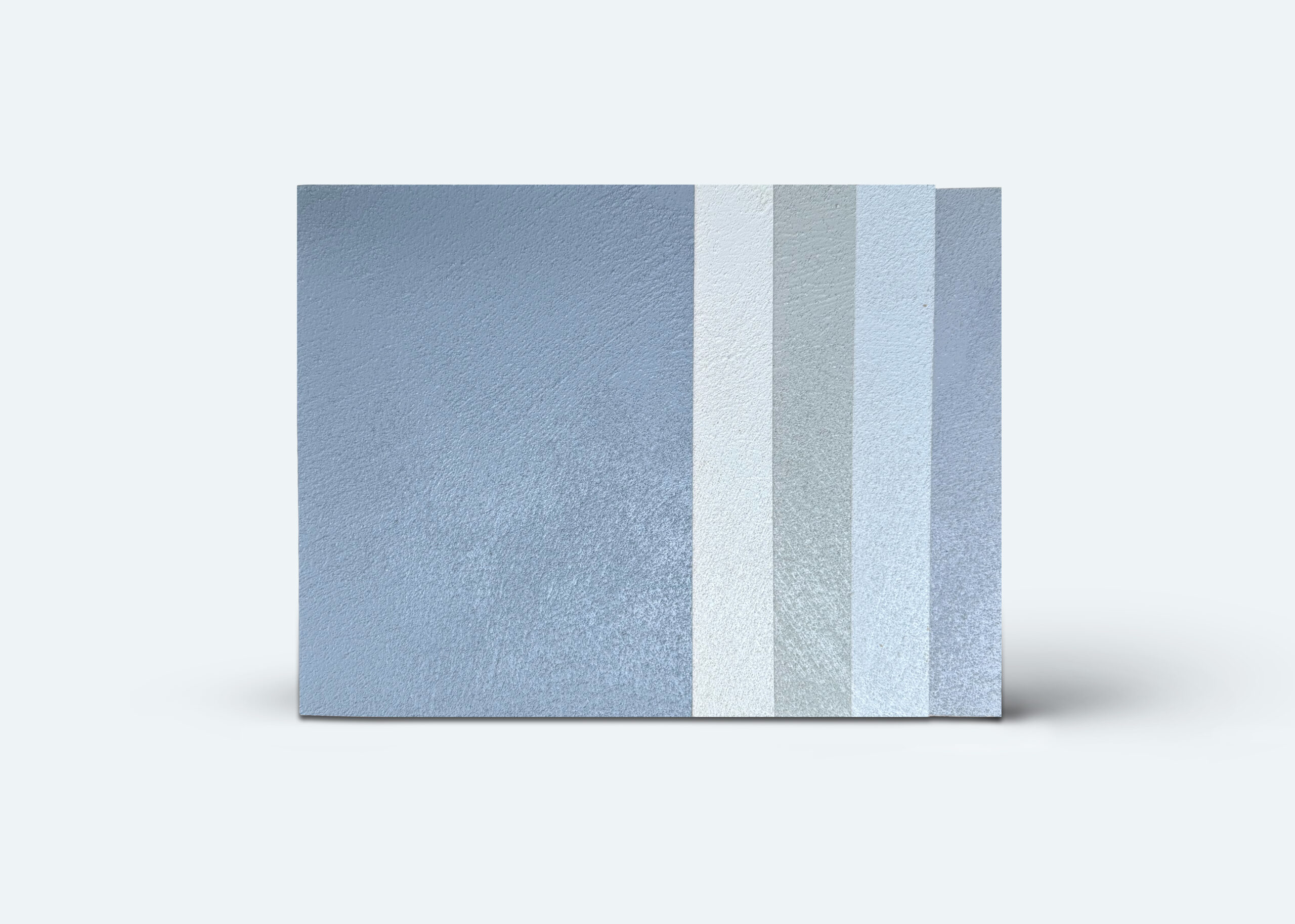 Musterplatten in verschiedenen Blau- und Grautönen für fugenlose Wandgestaltung mit COLORIAMO-Marmor-Streichputz.