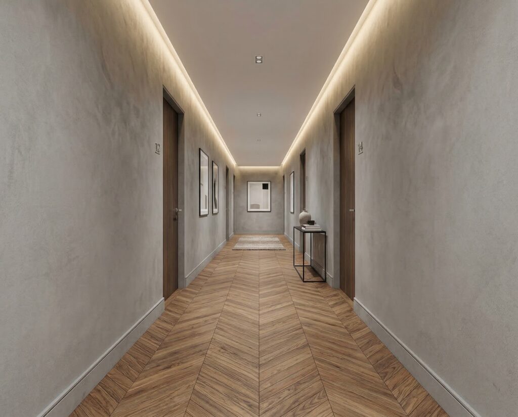 Ein stilvoller Flur mit elegantem Marmorputz und Holzfußboden, ideal für moderne Wandgestaltungen im Wohnzimmer. COLORIAMO Marmorputz 0,7 CMR3